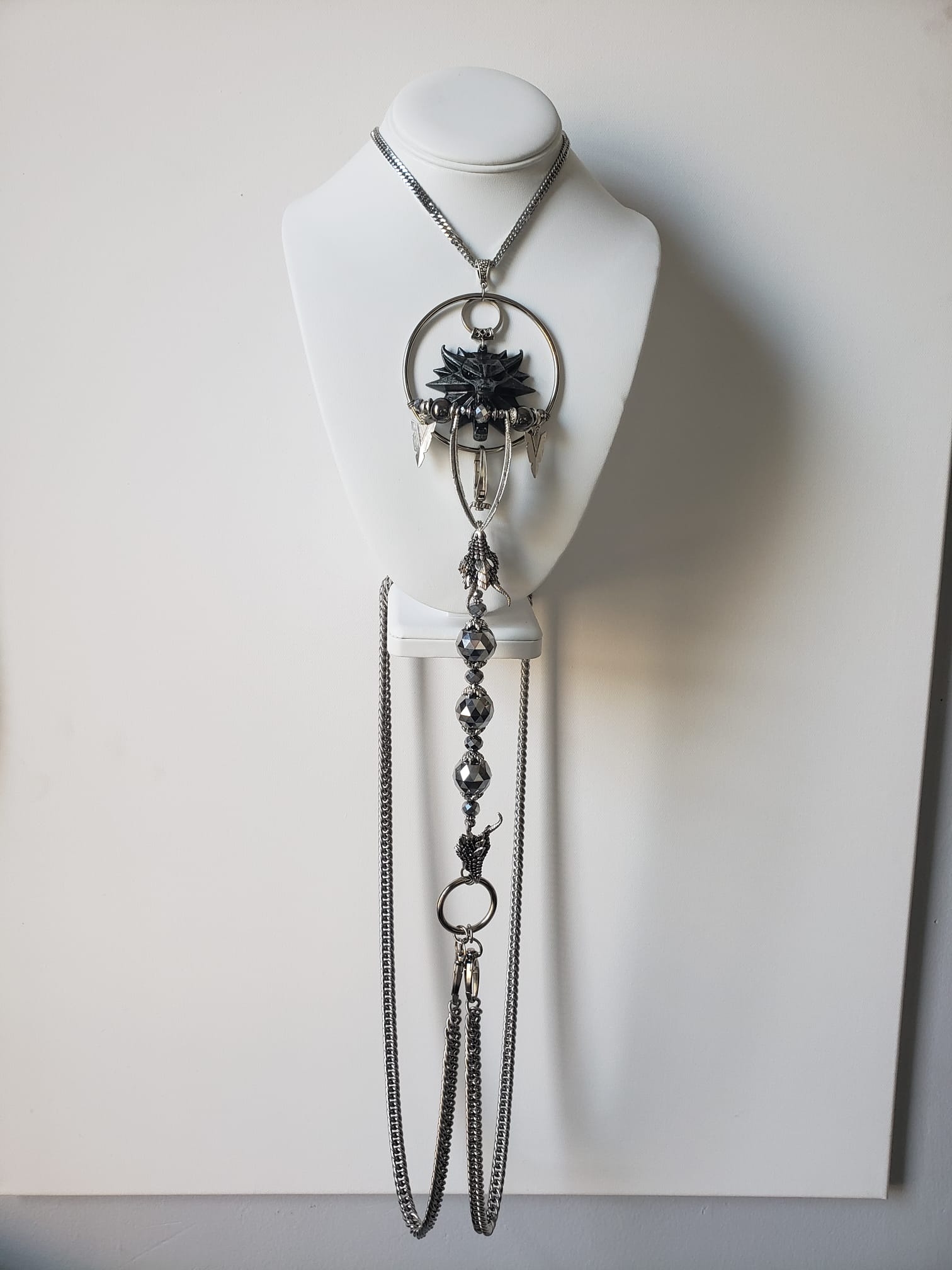 Dark pendant body chain with cascading silver chains