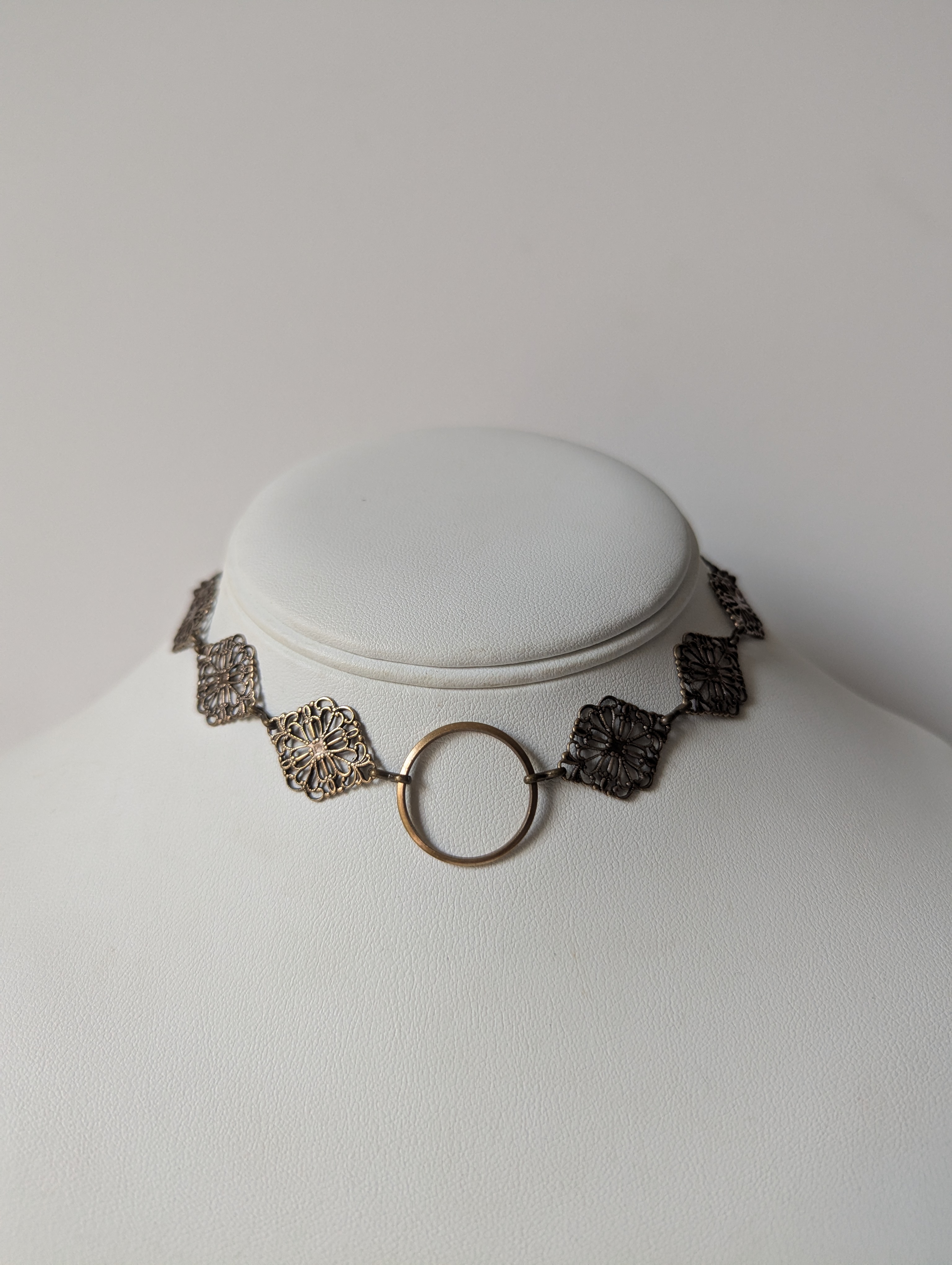 Gold butterfly pendant with filigree detail and crystal beadwork